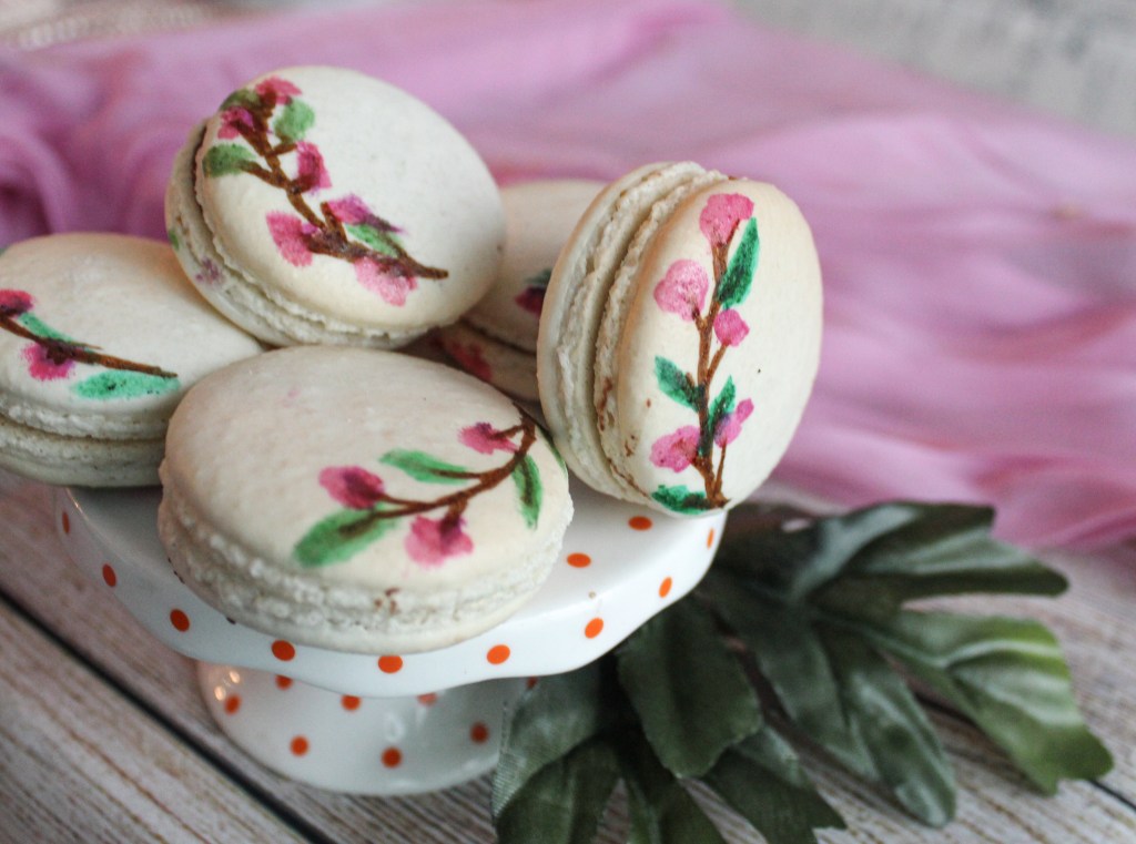 AnumHashim's tweet image. Today on the blog, sharing how to create hand painted floral macarons! All you need is edible paint and a food safe paint brush. Read on for a tutorial! #macarons #paintedmacarons #bakingblog sprinklesandscribbles.com/hand-painted-f…