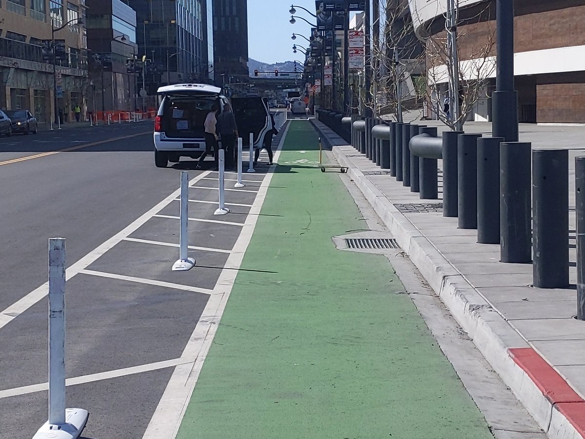 16th at the new basketball arena: 8'11" eastbound, 7'4" westbound. Both get blocked daily by people loading stuff. Here's a typical example - parked correctly, but still using the bike lane as a staging area.
