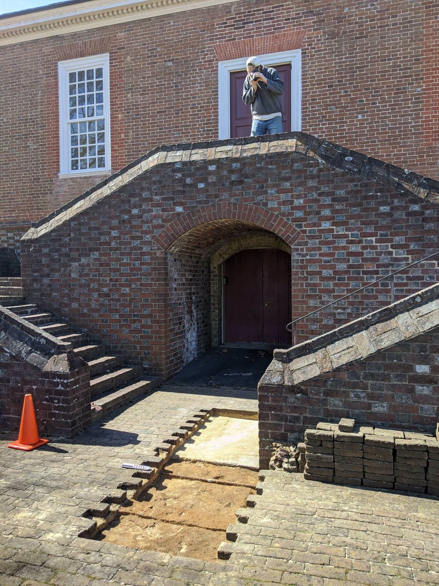 fairfieldfound's tweet photo. It’s nice when they build this HUGE brick platform and stairs just so you can take nice pictures. Today we started looking for evidence of the 18th-century porch...and we found a utility trench cutting through a possible archaeology trench cutting through a gravel and brick layer https://t.co/fgLL9QYzGR