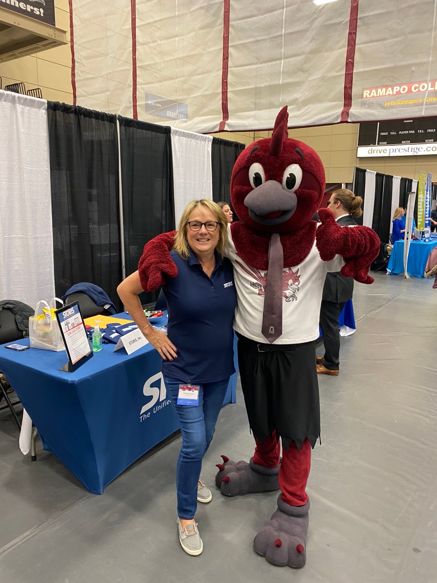 STORIS's tweet photo. STORIS' Director of Application Development, Marybeth, is hanging out with @RamapoCollegeNJ mascot, the Roadrunner! We're excited to meet students at the career expo and share our vision with them. #DiscoverTheDifference #TheUnifiedCommerceSolution https://t.co/76CRQZ6mye