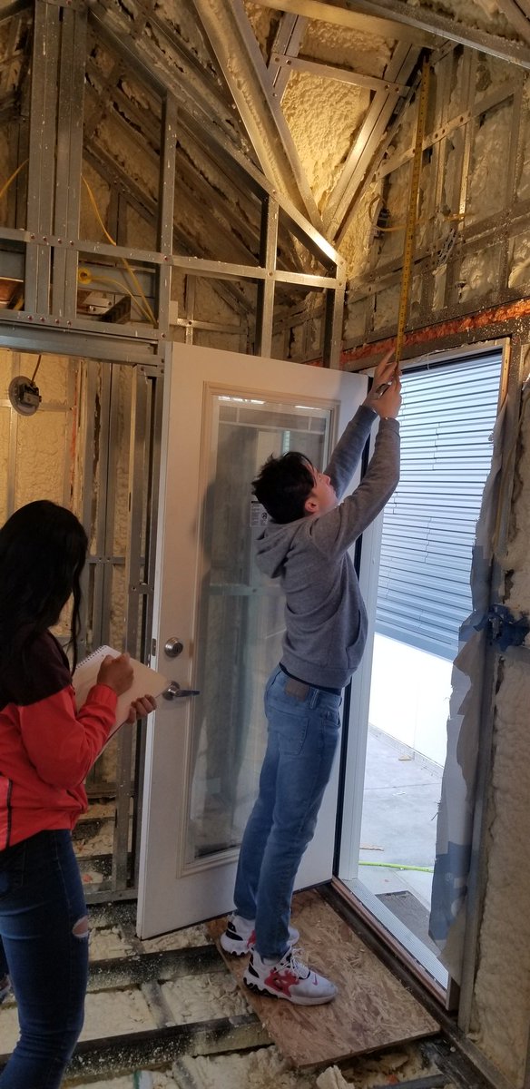 HCampbell204's tweet photo. Real Life Geometry happening today.  Students were given different sections of the BSHS Tiny House and must find the surface area and will report back to Mr.Mellick, the amount of ship lap that is needed for all the interior walls and ceiling.  @bshsprincipal https://t.co/Asr535tB0l