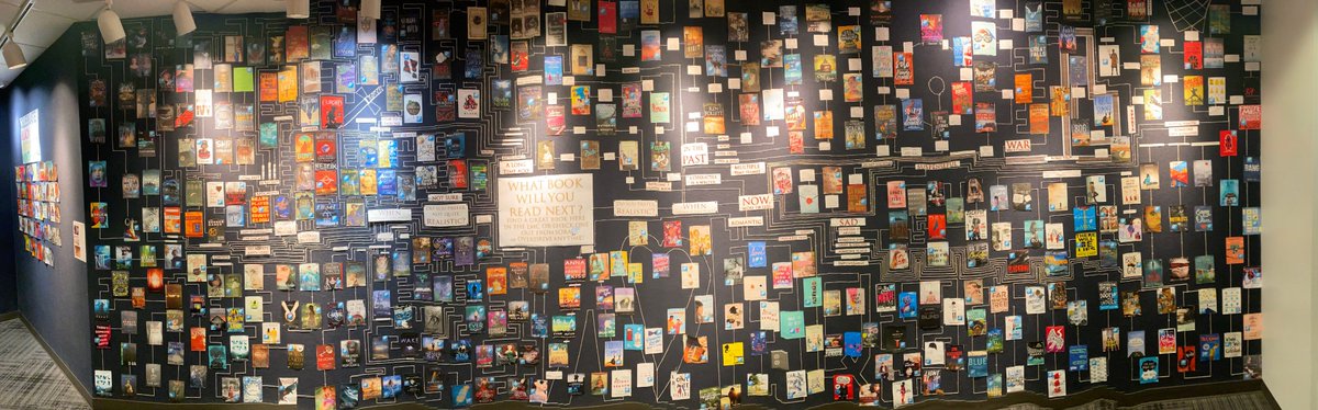 LSNLMC's tweet photo. Ever wonder what a librarian's brain looks like when you ask for a book recommendation? Here's a panoramic of our new hallway display. 450ish connected book recommendations using 10,000 staples and 600+ feet of string.  It should be complete by late May. #read #molibraries https://t.co/sBx7fCuYQx