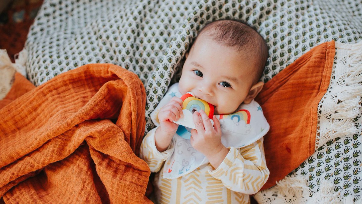 sillichews's tweet photo. A little sunshine 😊 and her rainbow to kick off your weekend! 🌈 Have you checked out our new bib-and-teether sets? https://t.co/VjJyDewu0J