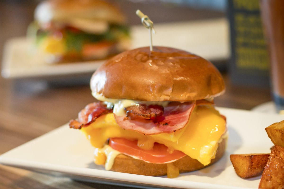 RelLishBurger's tweet photo. Double Piggy #Breakfast Sandwich at #RellishBurgerLounge! #ScrambledEggs, #Bacon, #CanadianBacon, Tillamook Cheddar, tomato, signature sauce on #brioche! #RellishtheDay on #ConcourseB @flySEA https://t.co/kAGdAQzvEE