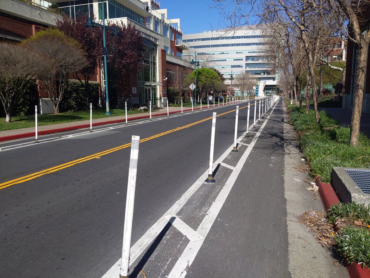 Got a few more bike lane widths to measure today. First, Emeryville's Horton, from curb to post: 5'7". These seem to work for keeping drivers out.