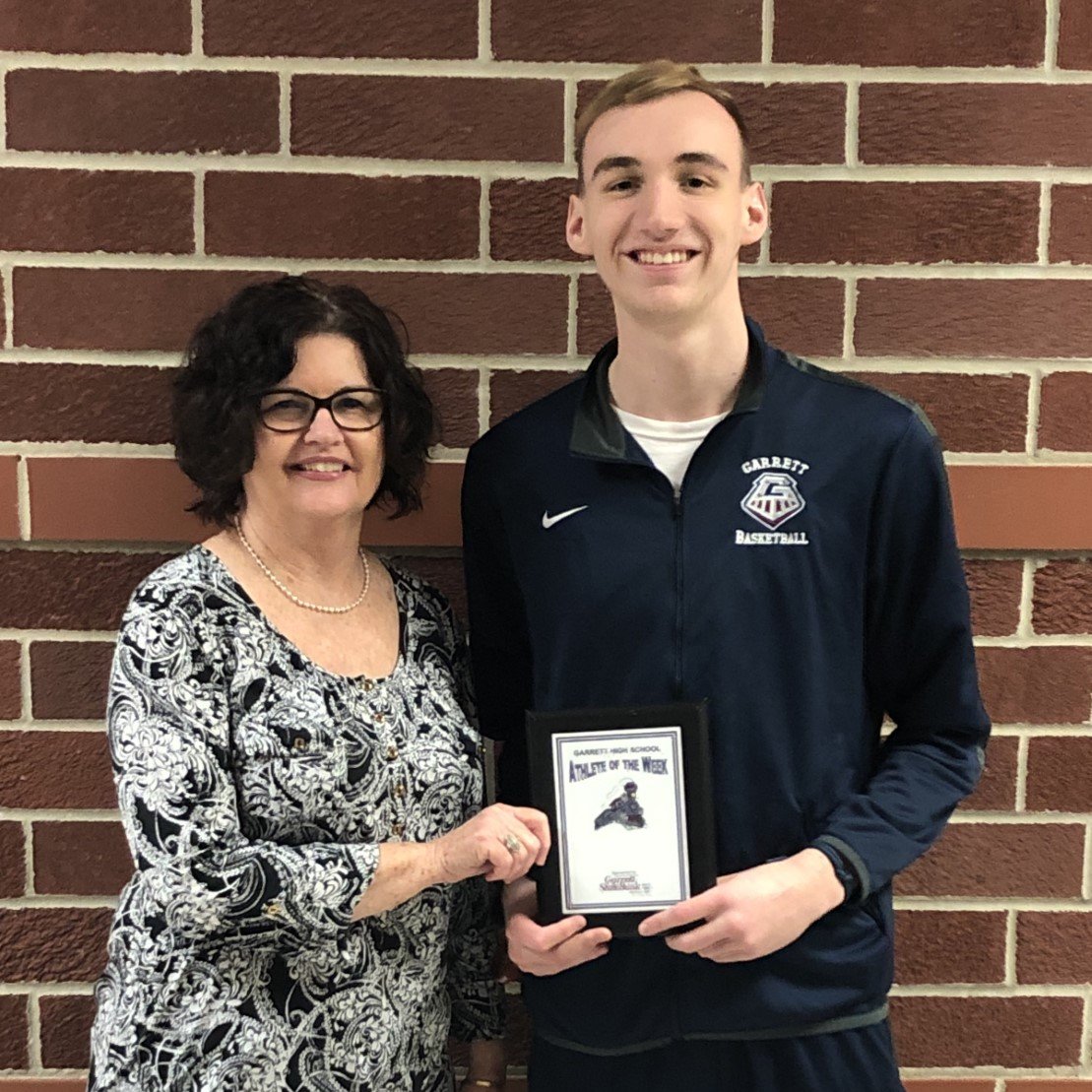 GarrettStBank's tweet photo. Congrats to Jarrett Bailey on being named this weeks Garrett High School Athlete of the Week! Jarrett is a senior basketball player. Presenting the award is Assistant Branch Manager at the main office, Mary Placencia. https://t.co/wV6VjqAVKb
