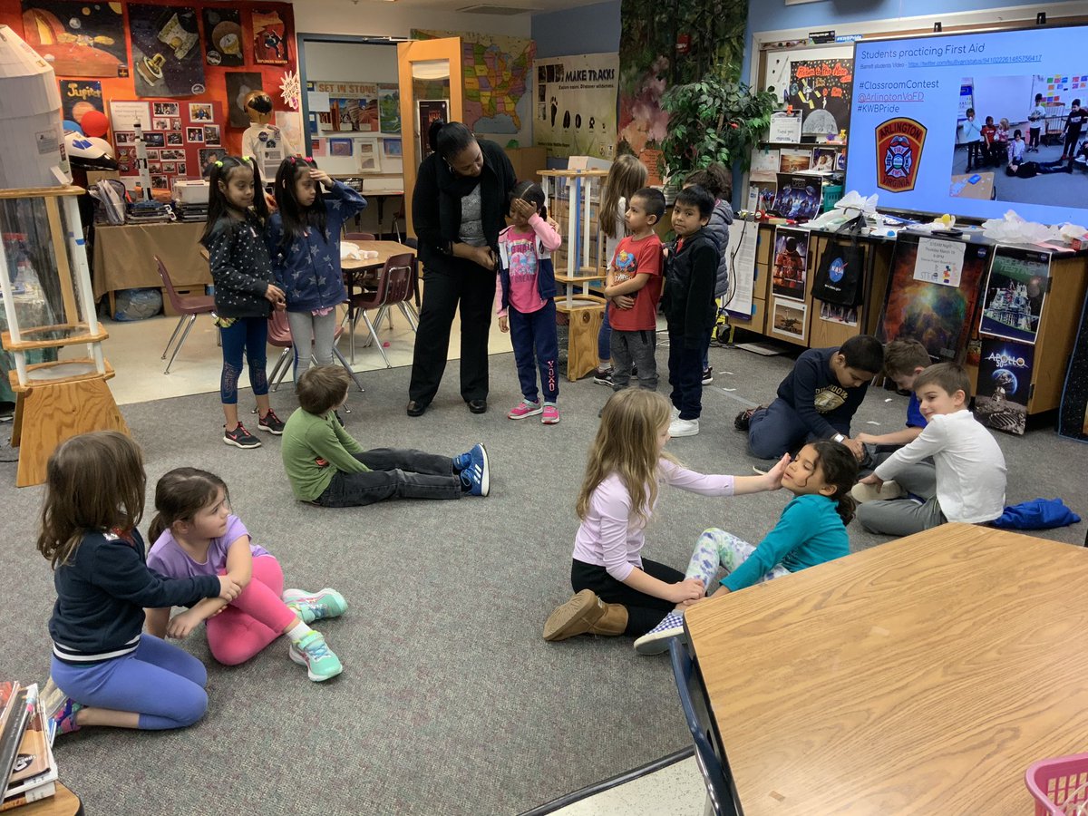 lsullivan's tweet photo. Students practicing first aid for the Arlington Fire Department Classroom Contest @ArlingtonVaFD #ClassroomContest @KwbVaughn #KWBPride Barrett Tiger Mascot https://t.co/H9O7SDZK1W