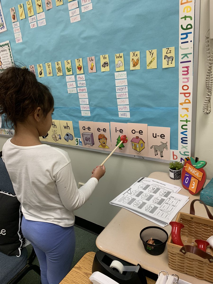 We love playing “teacher” to practice our long vowel sounds