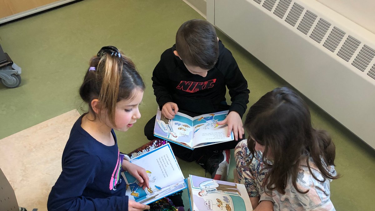 Dr. Seuss book clubs begin today.  Firsties reading, talking, and creating posters about books is the plan!  #firsties #DrSeussWeek