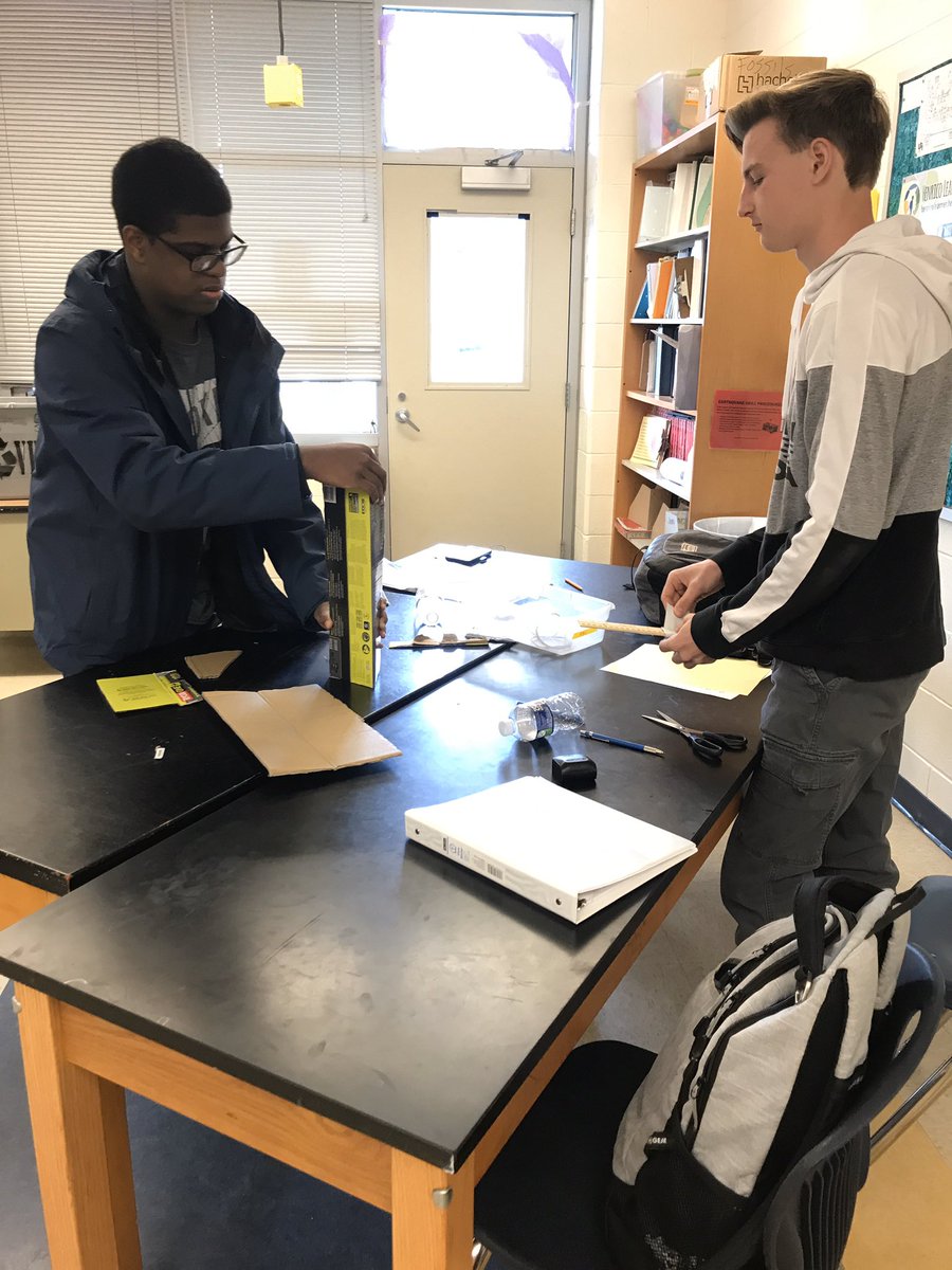Mr. Medici oceanography working on the Bottle Raft Design Challenge design phase.  Based on Archimedes Principle. Next class testing their designs in a turbulent and windy ocean.