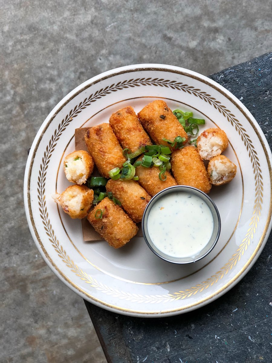 punkshouston's tweet photo. Creamy rice loaded with bacon, cheddar cheese, and scallions, rolled in potato crisps and fried served with buttermilk ranch https://t.co/6RMeqx9zNq