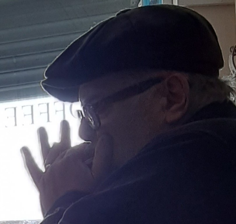 Jack Burness on harmonica in the cafe yesterday.