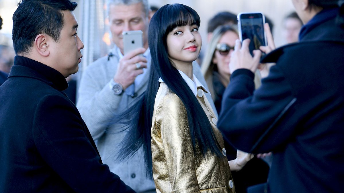 VogueRunway's tweet photo. Blackpink’s Lisa won the front row at @Prada's fall 2020 show with this look. https://t.co/fiZBlVK9bK https://t.co/TsD1AIKgSd
