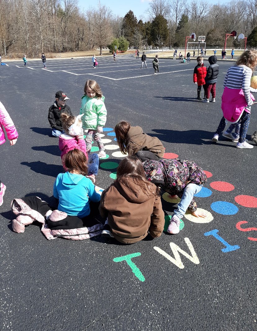 PESBulldogsIN's tweet photo. These PES students enjoyed the recent warmer weather during recess by playing a game of Twister that is painted on the playground.  #socsowen https://t.co/ZbRWtD6Bvw
