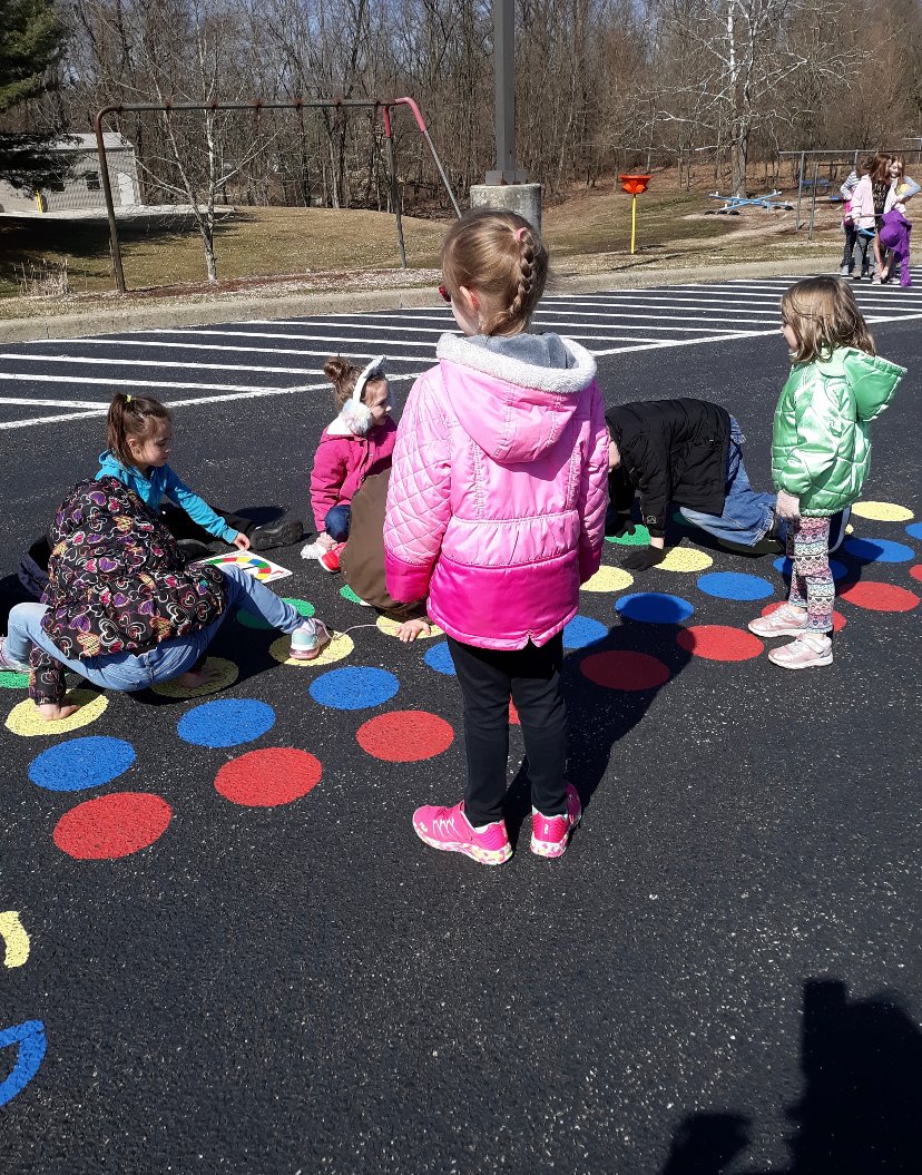 PESBulldogsIN's tweet photo. These PES students enjoyed the recent warmer weather during recess by playing a game of Twister that is painted on the playground.  #socsowen https://t.co/ZbRWtD6Bvw