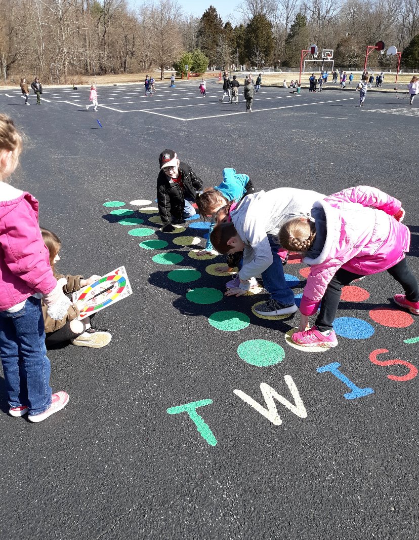 PESBulldogsIN's tweet photo. These PES students enjoyed the recent warmer weather during recess by playing a game of Twister that is painted on the playground.  #socsowen https://t.co/ZbRWtD6Bvw