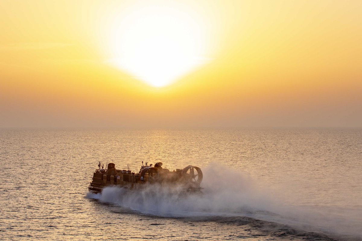 CENTCOM's tweet photo. A landing craft, air cushion, attached to Assault Craft Unit 4, exits the well deck of the amphibious assault ship USS Bataan @LHD5 in the @US5thFleet Feb. 23, 2020 @USMARCENT #Marines @26MEU https://t.co/uKygV1oYig