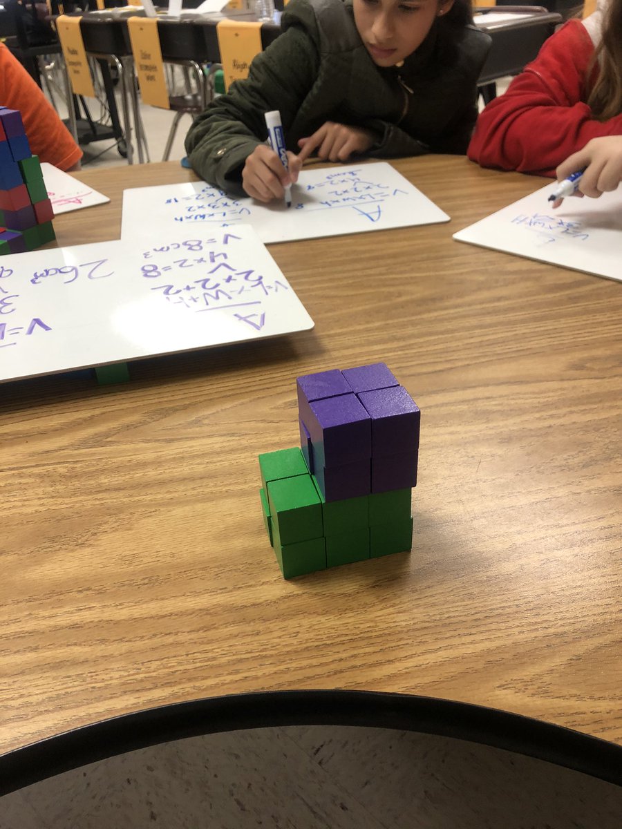 MsDandRaven's tweet photo. I have to brag about my kids. Composite volume has been a struggle. I asked what they needed and they said Miss Diamond can we use the cubes to build and then check with math and YALL. ITS. WORKING. Love their work and how their minds work.  #VCSmath @Slgood75 https://t.co/bzkwEqHyuS