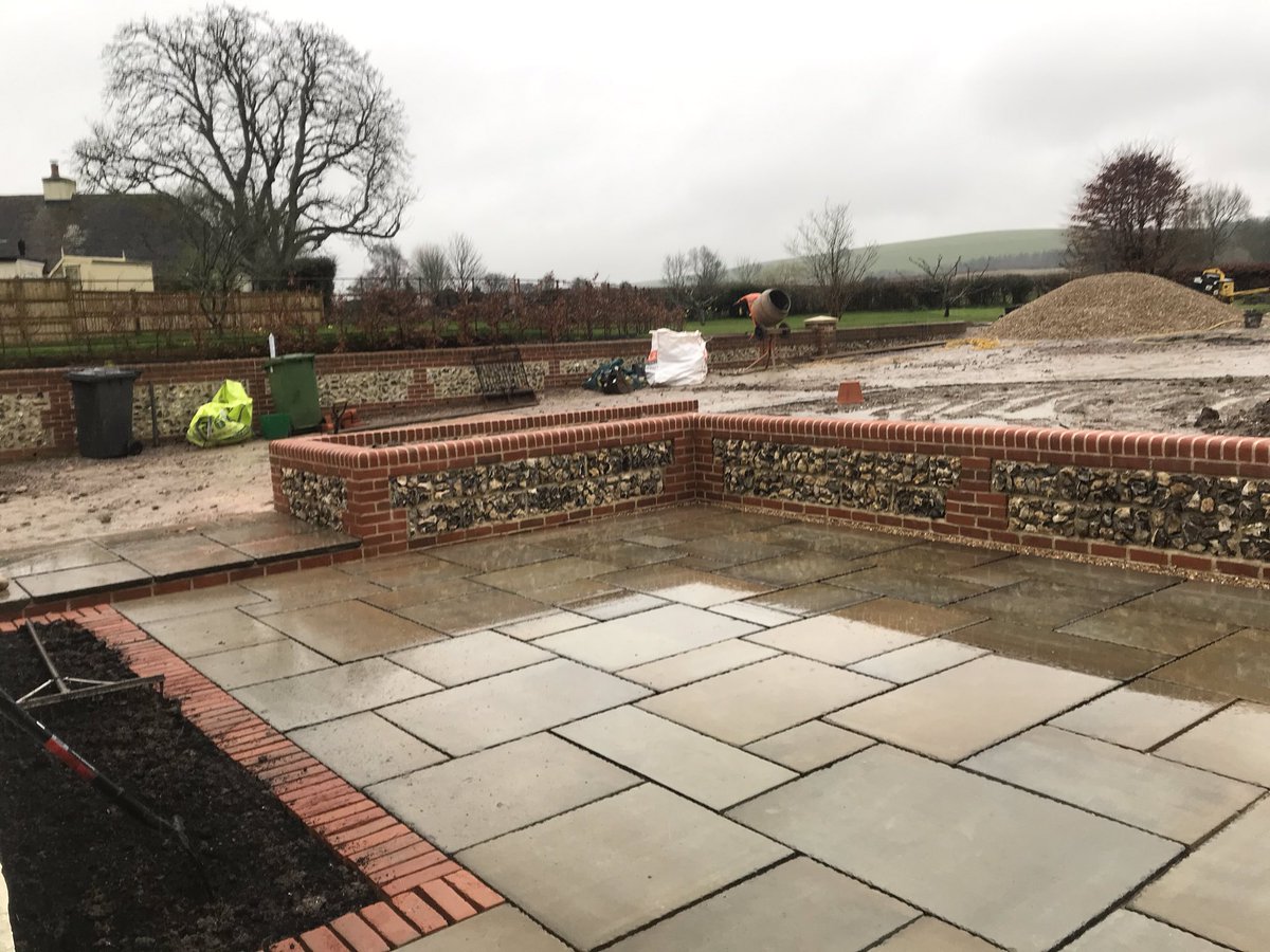 NCGardendesign's tweet photo. Wonderful craftsmanship from Steve @TransformLands #flintwall #gardendesign I can’t wait for the #plants and #turf to finish the #design https://t.co/Aq1QkD3Oza