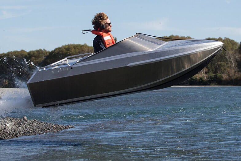 man in tiny boat that got launched into air by a wave