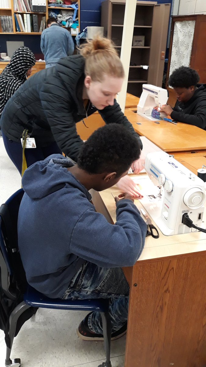 Ms_King819's tweet image. Mrs. Mitchell helping her student thread the machine in Apparel and Textiles. They genuinely were intrested in what that were doing. @rockinrams @ydstubblefield @Kenscott27 #SewingLab