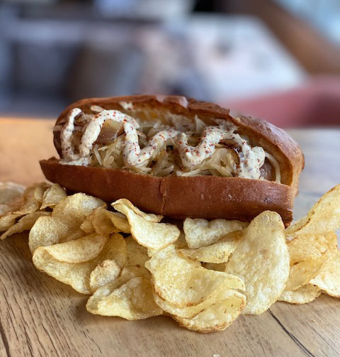 We never met a Bratwurst we didn't like, especially our St. Patty's Bratwurst. [New England Roll, Sauerkraut, Caramelized Onions, Stone Ground Mustard,Fries or Chips]