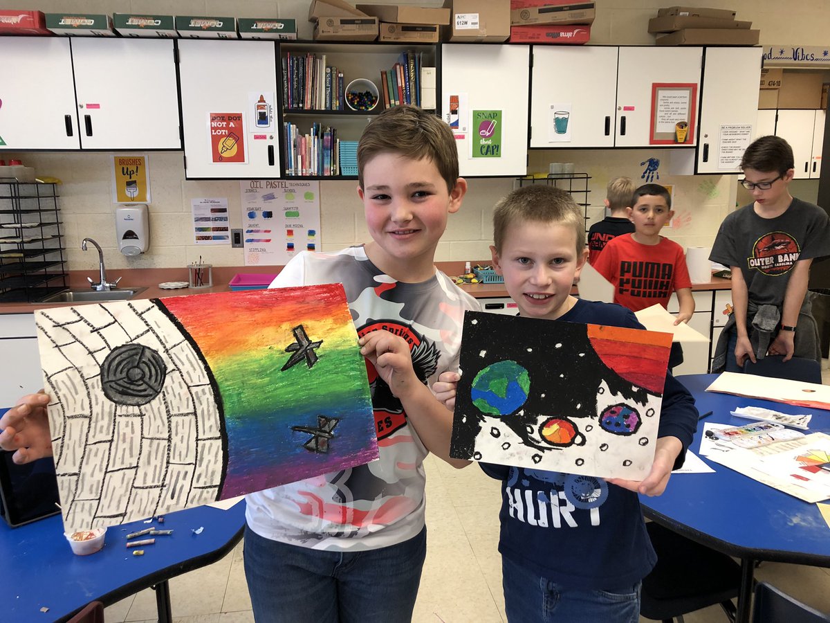 4th graders are working on an independent project where they had to include all 12 colors from our adv. color wheel in a surrounding. Cameron and Jake were both drawn towards outer space as their subject matter and are using new techniques to blend oil pastels! <a href="/MsThompson_BSES/">Ms. Thompson - 4th Gr. ELA</a>