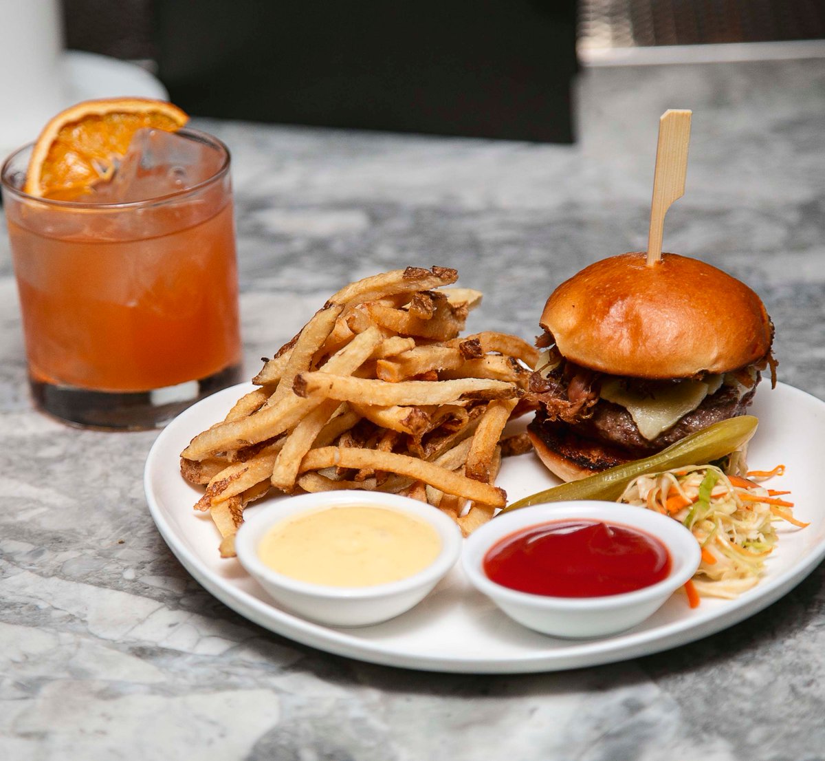 Our cocktails are on point, but so too is our food. And John's Burger is an absolute Cloak favourite 🍔

With mouthwatering meat, sharp cheddar, and tangy relish, all wrapped up in a warm brioche bun, this is one of the best burgers in the city 👑

#burger #toronto #yyz #food