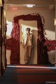 The doors scene in the MV seems to be inspired by an art piece called “Svayambh” (“self-made.”) created by Anish Kapoor. Kapoor who designed the artwork himself along with help from an engineer stated that “It’s as if it’s skinning itself as it goes through the doors.”