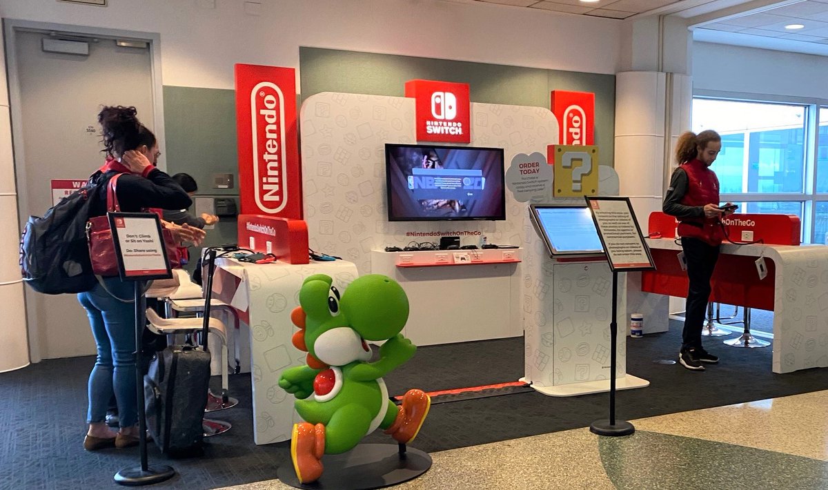 flySEA's tweet photo. Hang with Yoshi at the @NintendoAmerica pop-up lounge! Open every day until March 29 from 7 am to 7 pm next to gate C10. All games are free to play! 🎮 #NintendoSwitchOnTheGo https://t.co/dikn4ktaqu