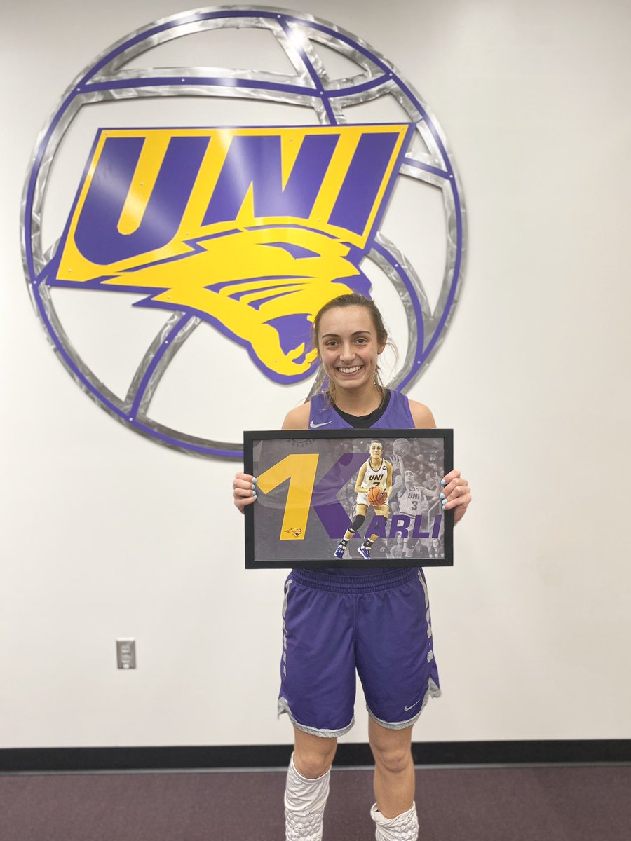 UNIwbb's tweet photo. To commemorate this amazing achievement we presented Karli with this gift! 💜🏀

#UNIFight #1K https://t.co/9nVe1kMsTH