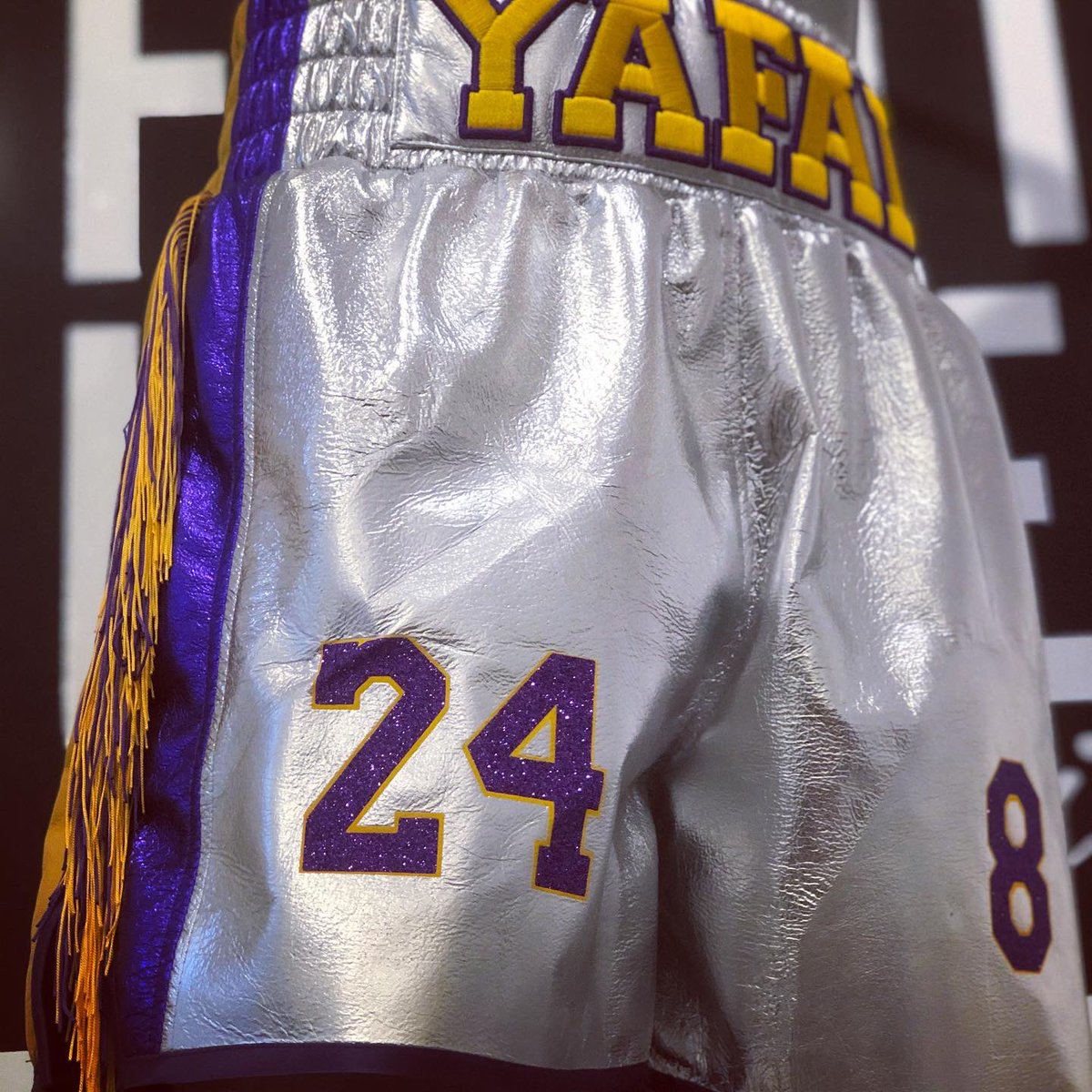 FightLabel's tweet photo. M E T A L L I C A @iam_yafai lighting up @thestarinfrisco in our silver foil leather with touching tribute details to Kobe #FightLabel #Boxing #Boxeo #BoxingShorts #Shorts #Fringing #Tassels #Lakers #Dallas #Texas #Frisco #YafaiGonzalez #YafaiChocolatito #GarciaVargas #DAZN https://t.co/dQIDceZJAD
