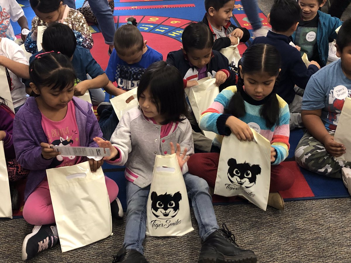 ecityservices's tweet photo. TIGER SMILES 2020! Today we went to kinder &amp; TK classes at Sunset, Kirk, AND Comubia Elementary. We taught them how to brush their teeth &amp; floss. All students received a goodie bag &amp; made a pledge to brush their teeth everyday :) #dobetter @ChemwithClick https://t.co/soshqLS4XE