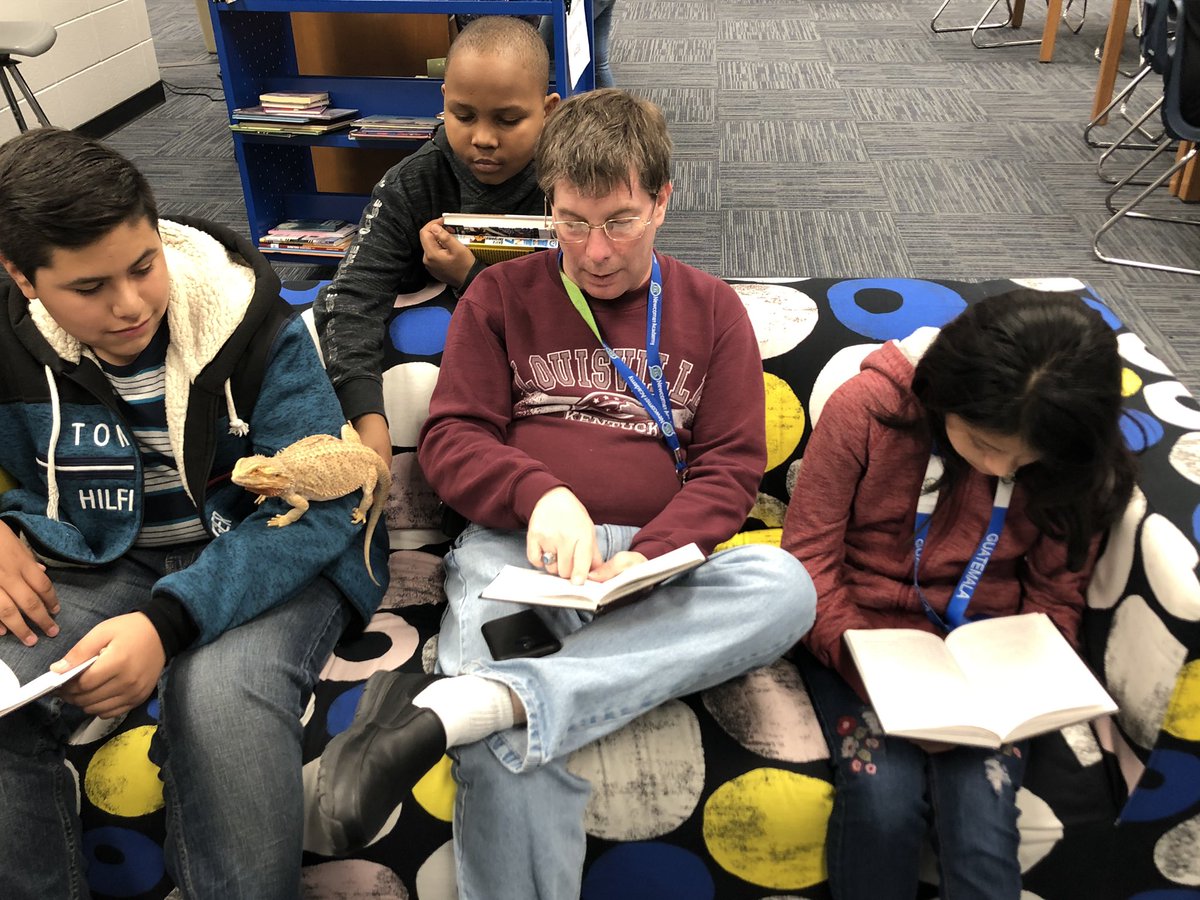 NewcomerAcademy's tweet photo. Reading #LongWalkToWater together in the @NewcomerLibrary with Oliver the #BeardedDragon https://t.co/npjec4aiWS