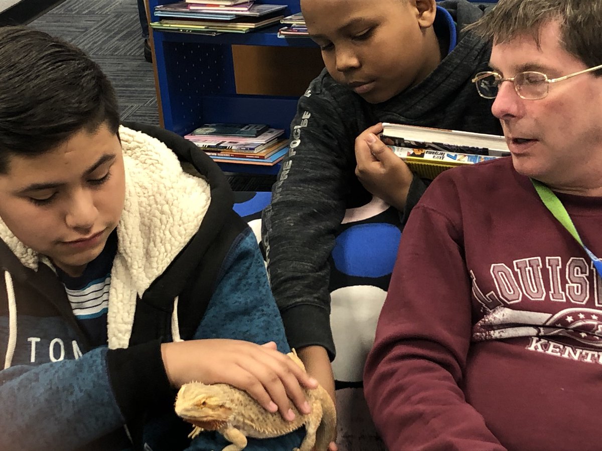 NewcomerAcademy's tweet photo. Reading #LongWalkToWater together in the @NewcomerLibrary with Oliver the #BeardedDragon https://t.co/npjec4aiWS