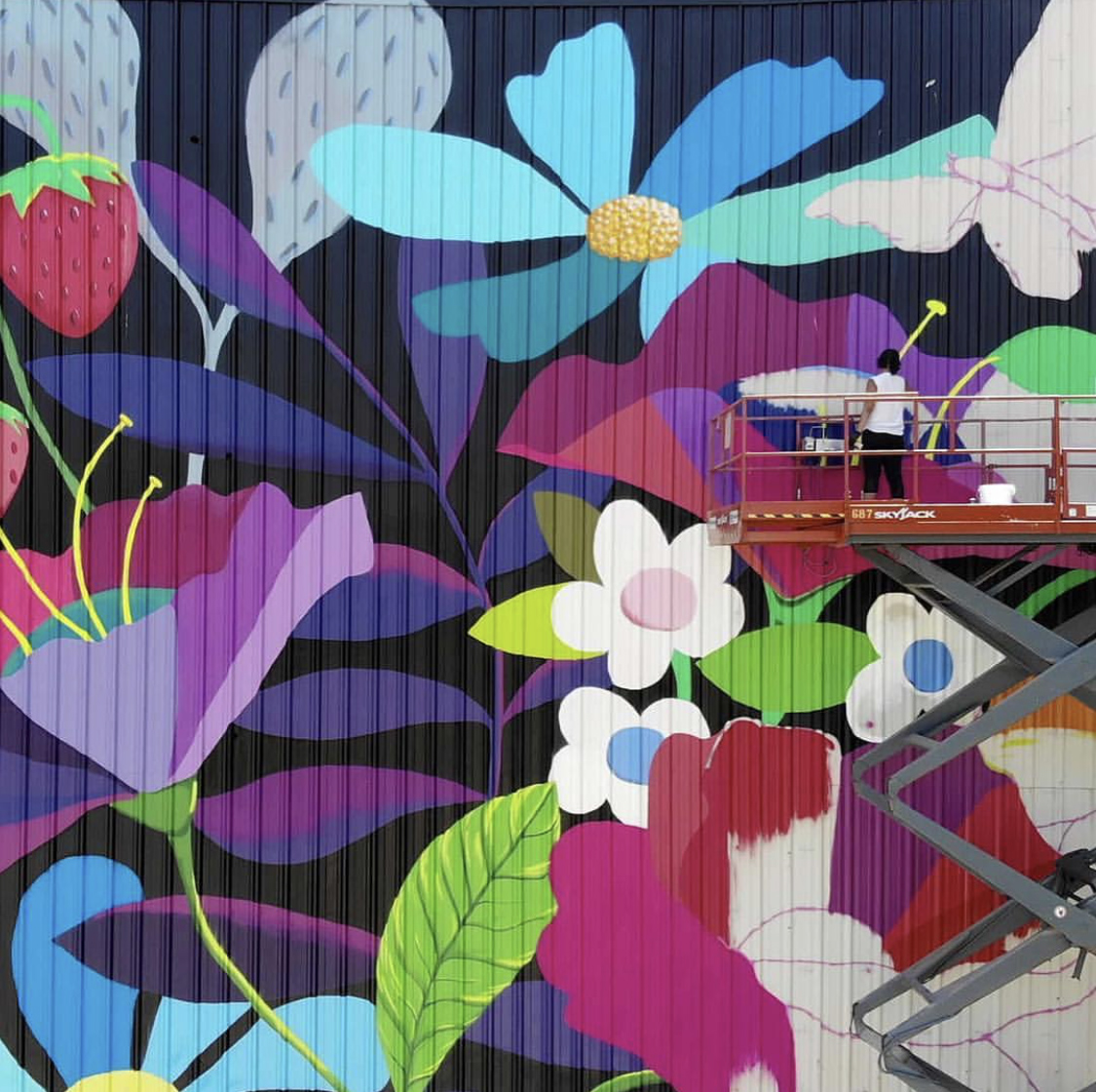 The310W's tweet photo. Coming to Westown this spring: A mural over 90 feet long and 15 feet wide on the 2nd Street Skywalk! For now, here’s a throwback to Emma Daisy’s masterpiece “Westown In Bloom”. 📷: Emma Daisy - https://t.co/DroZrQD58J https://t.co/fuZ0njpJH1