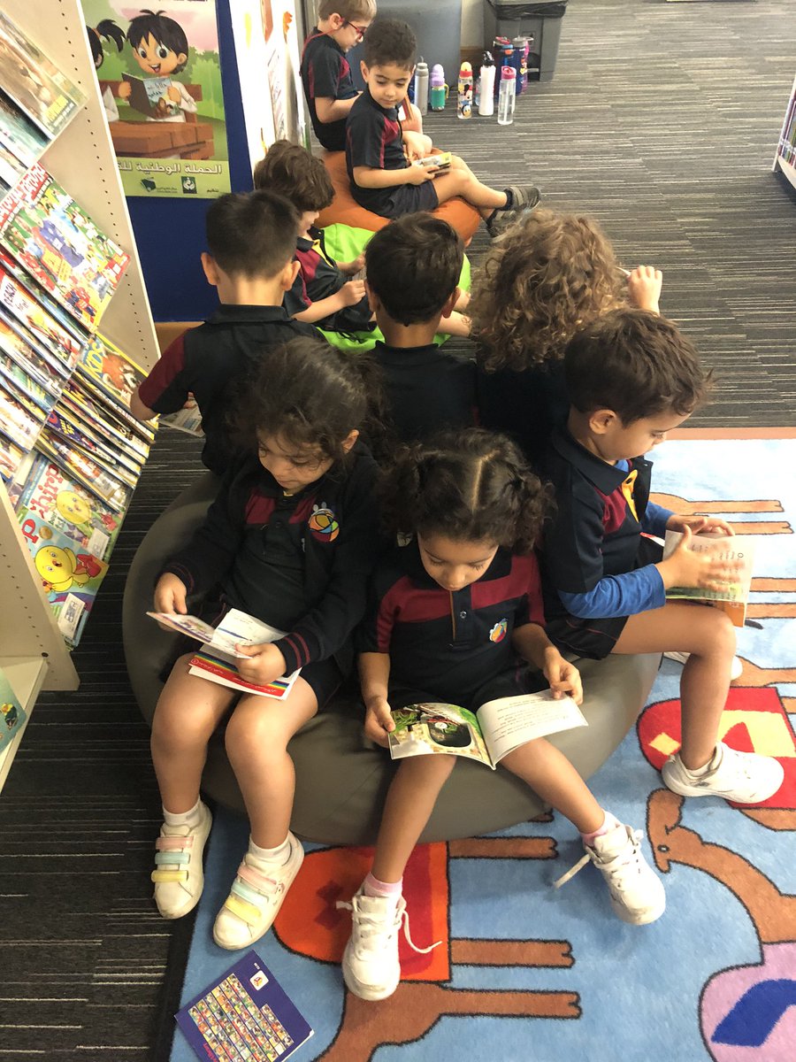 How many students can fit on a beanbag?! Reading fun in the library with KG1C #KG1C #WeRGIS #Lovingreading #Primarylibrary