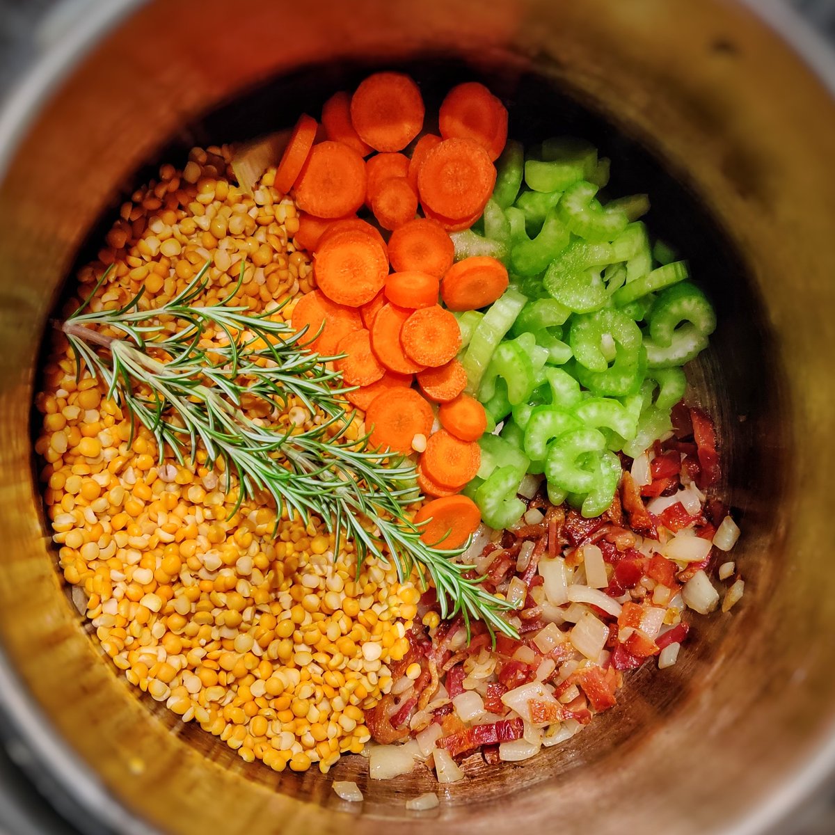 sed's tweet image. Yellow Split-pea soup based on @RadRachelLove's homemade chicken broth. Seen in the pressure cooker. #pressurecooker #pressurecooking #splitpeas #splitpeasoup #yellowsplitpeas  #bacon #onions  #chickenbroth #rosemary #potato #shiitake #celery #carrot #soup #beavercreekoregon