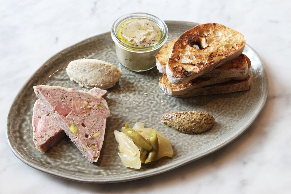 What is it about charcuterie that makes is irresistable? Is it about the bread, the pickles or the mustards? We think, it's about the entire composition which is why our charcuterie comes with our housemade pickles, wood-fire grilled bread and sorghum mustard.
