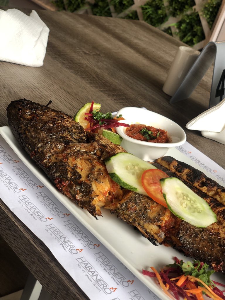Habanero RestaurantGana street MaitamaGrilled Croaker Fish & Roasted plantain- N5000Pineapple &ginger- N1200 Full Review on IG : PamsFoodtour
