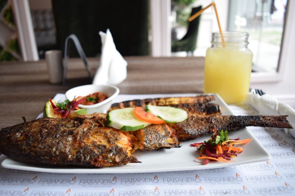 Habanero RestaurantGana street MaitamaGrilled Croaker Fish & Roasted plantain- N5000Pineapple &ginger- N1200 Full Review on IG : PamsFoodtour