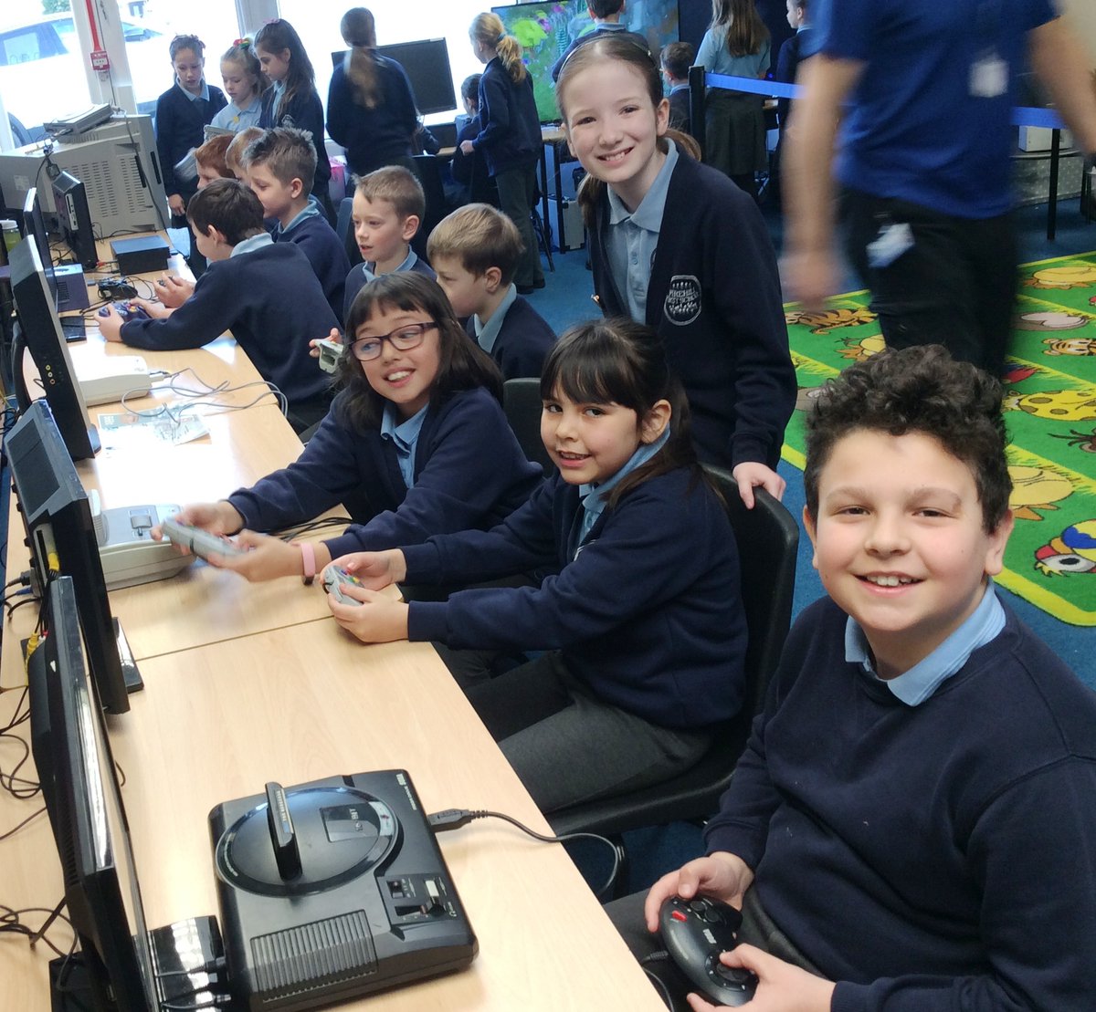 PirehillFirst's tweet photo. Yr 4 have spent the morning gaming! @coreedultd are running a "History of Gaming" workshop to finish off our Aspirations Week, as the pics show the children have loved it.  They've also loved the fact that staff have given their ages away, by saying what they played as a child! https://t.co/pMhtOVDy0f