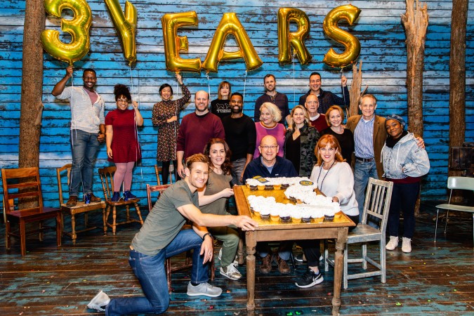 Photo of the cast in front of a number 3 made with cupcakes
