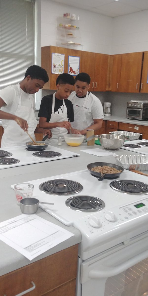 Mrs. Carter"  Foods and Nutrition 1 class making preparation working together to get the job done.