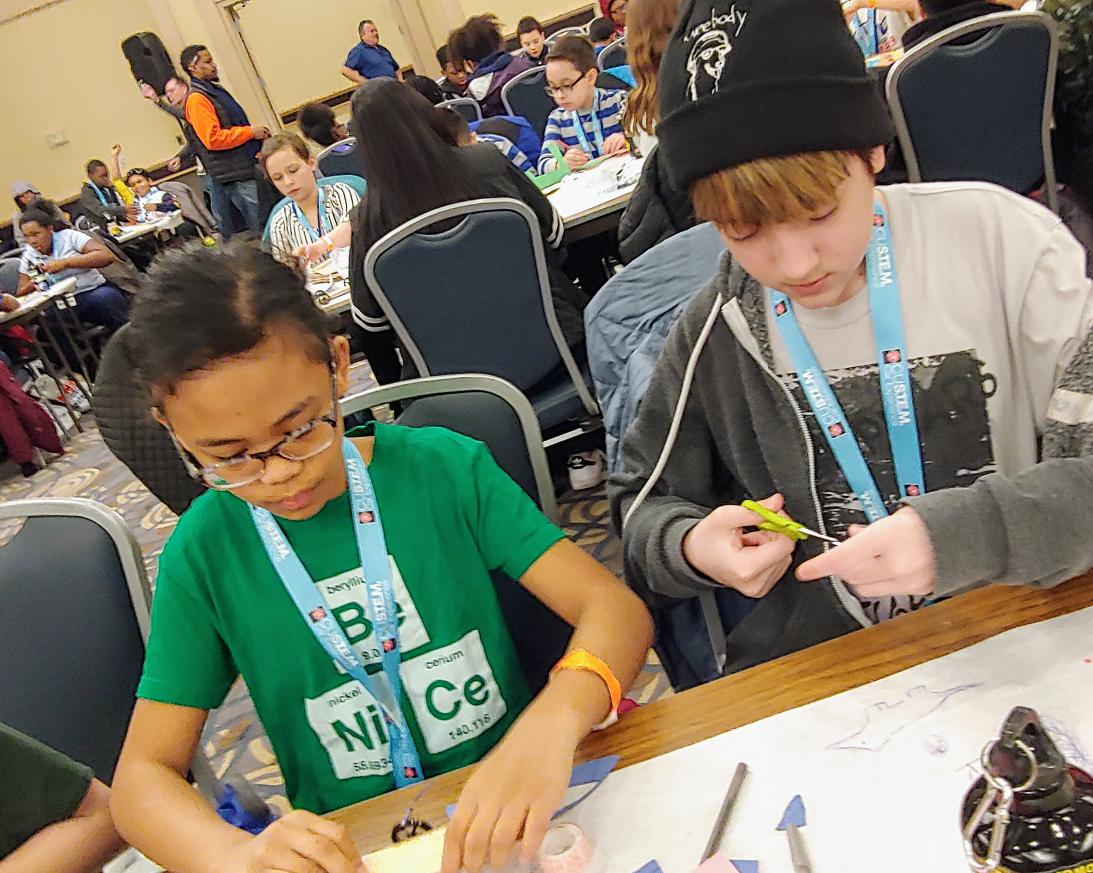 BellSTEAM's tweet photo. Immersed in custom car design...Bell's Science Olympiad and Robotics teams are loving the field trip to the Custom Car Show @semaeducation @Ten80Ed @AGBellSchool https://t.co/rTRgyUIqhE