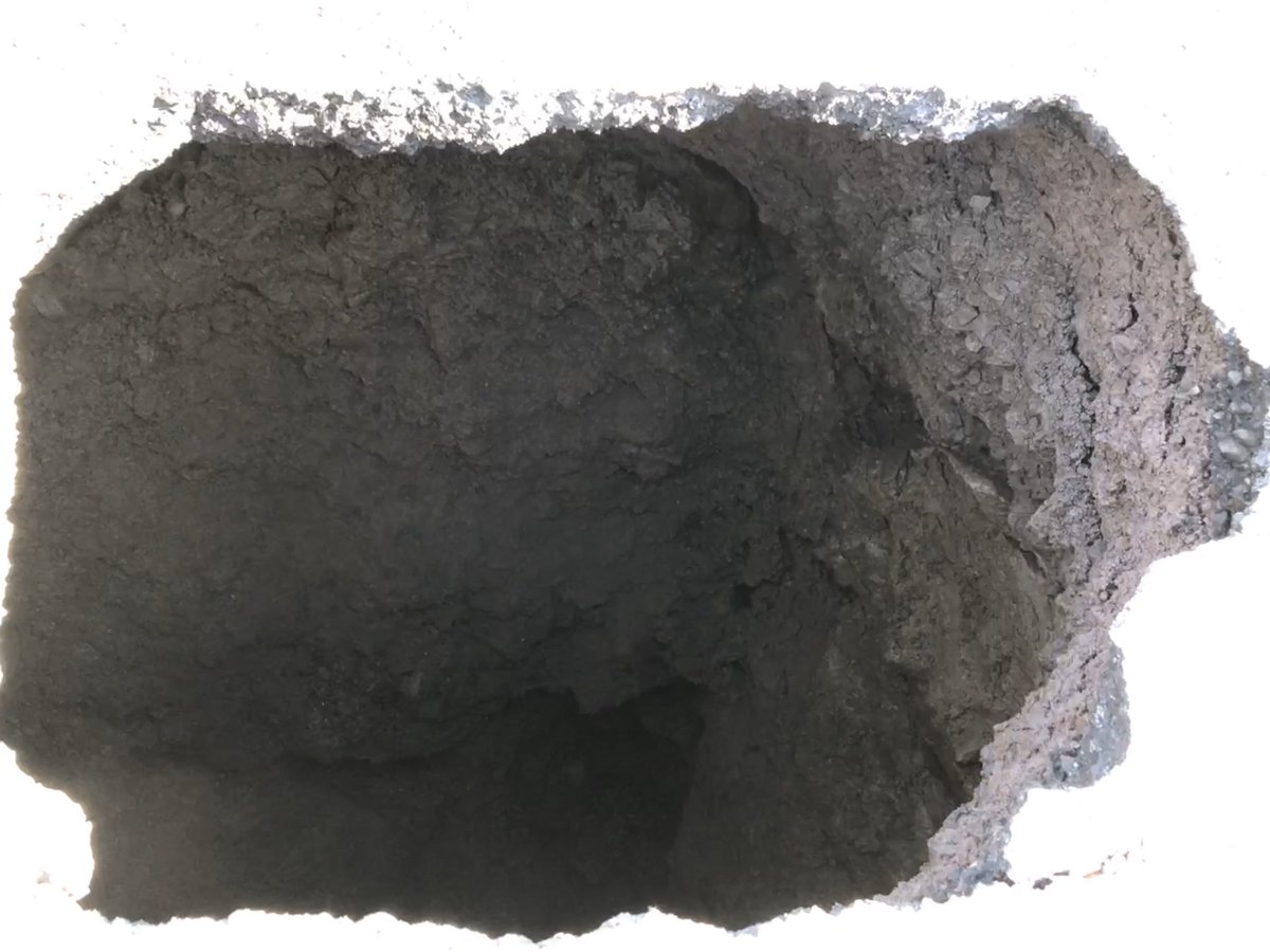 tomayers2262's tweet photo. Small sinkhole opened up by curb on Dominion Street, Reserve Mines. Officials say it’s about 4 metres deep. Appears to be subsidence from old bootleg coal mine, but sewer line is broken, so it could be just a pothole that broke bad. Road blocked, but expected to reopen tonight. https://t.co/g24hutMR1d