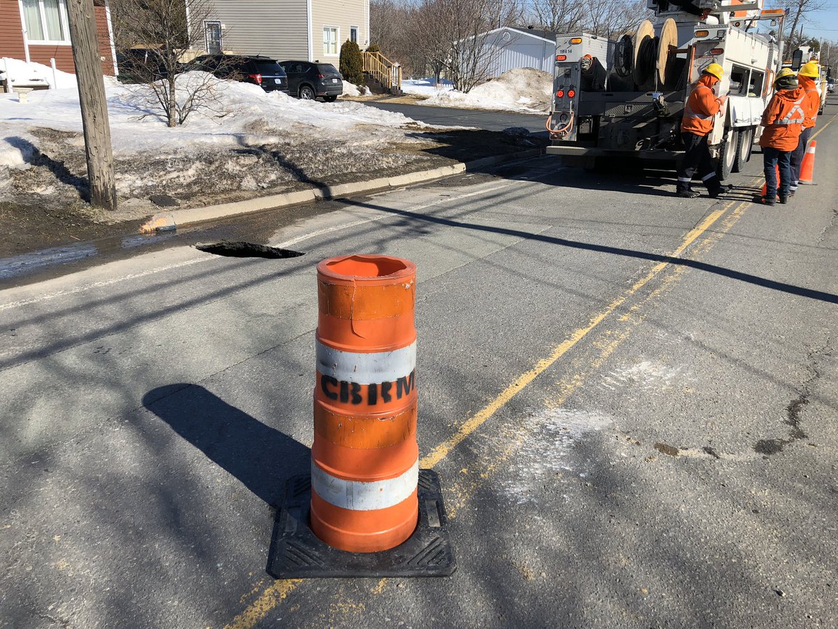 tomayers2262's tweet photo. Small sinkhole opened up by curb on Dominion Street, Reserve Mines. Officials say it’s about 4 metres deep. Appears to be subsidence from old bootleg coal mine, but sewer line is broken, so it could be just a pothole that broke bad. Road blocked, but expected to reopen tonight. https://t.co/g24hutMR1d