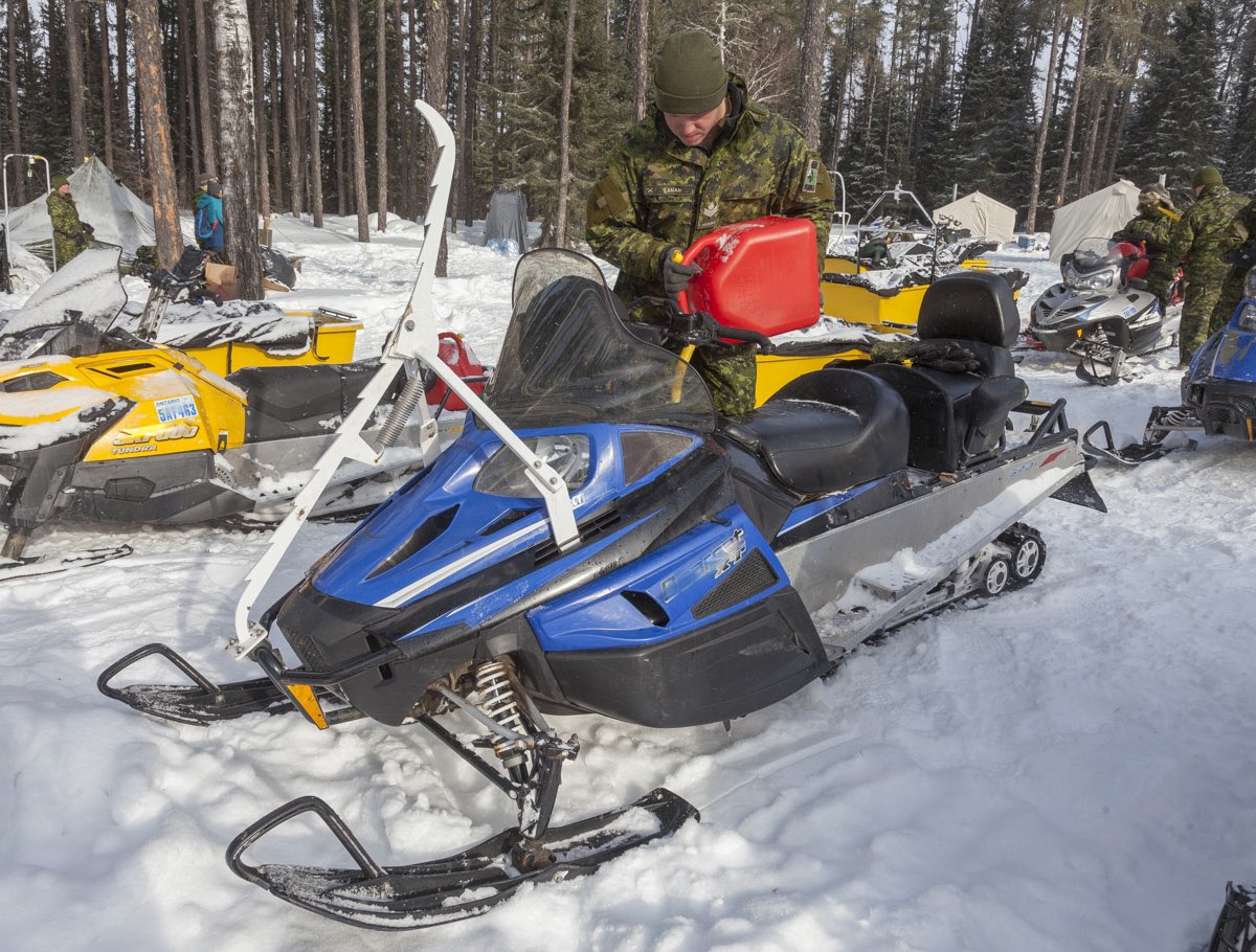 CdnArmyToday's tweet photo. The key to winter mobility in remote northern areas.  MCpl Laman (Argyle and Sutherland Highlanders of Canada) of 3 PL. 4th Arctic Response Company Group of the 4th Canadian Division refuelling a Light Oversnow Vehicle (LSOV) during #Norex20 @CanadianArmy @CdnArmyToday. https://t.co/qwxI5HM61p