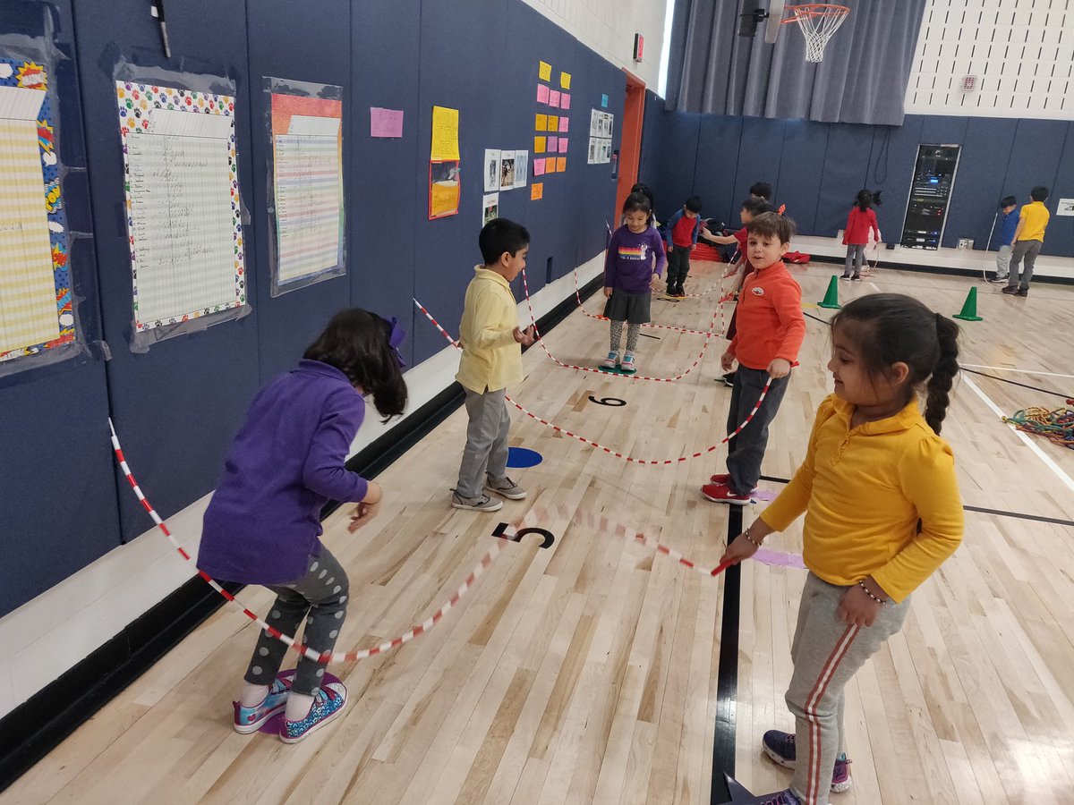 Kindergarten was on second day of jump rope week. They've moved on from jumping over baseball bats to actual ropes. Ropes were tucked into walls to lessen need to have 3 students in one group, thus giving students the opportunity to focus more on jumping. @30Q398 <a href="/nycdistrict30/">District 30</a>