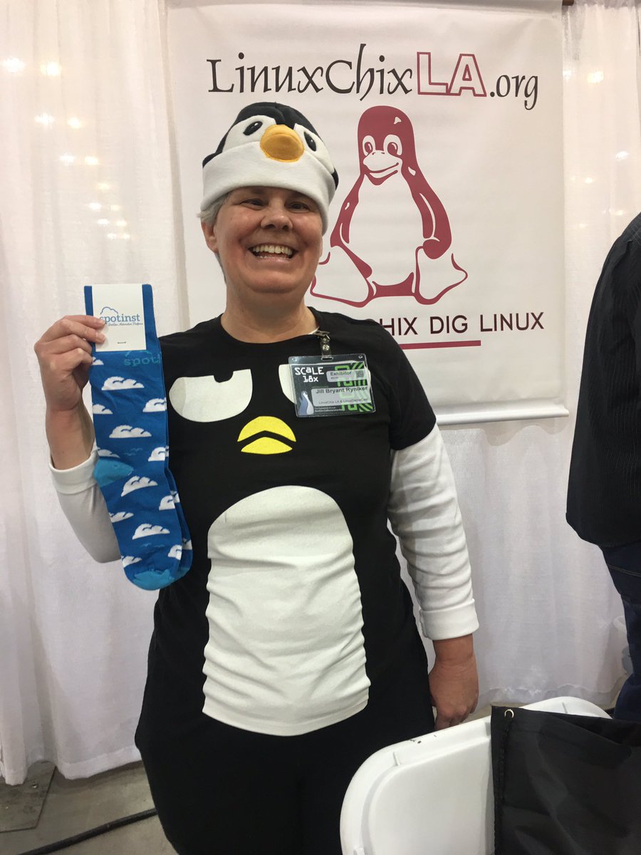 jordan247's tweet photo. Jill takes a break from setting up the #linuxchix booth to chat with the DevopsDayLA sponsor and score some closy sock swap from @spotinst . @socallinuxexpo #scale18x https://t.co/F0JVWC3lX3